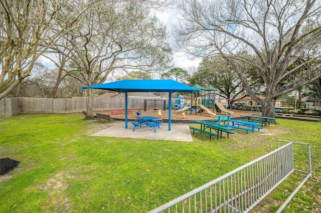 view of yard featuring a fenced backyard and playground community