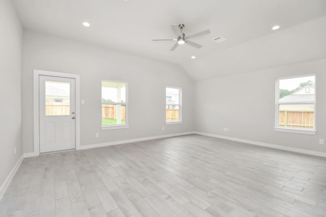 spare room with recessed lighting, light wood-style floors, baseboards, ceiling fan, and vaulted ceiling