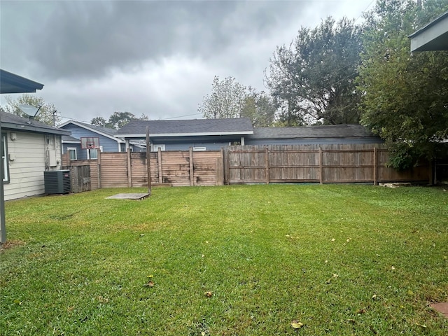 view of yard featuring cooling unit and fence