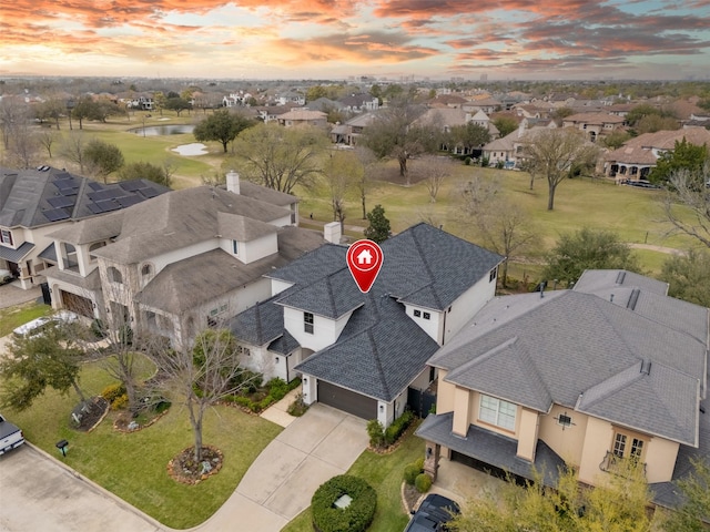 aerial view with a residential view and a water view