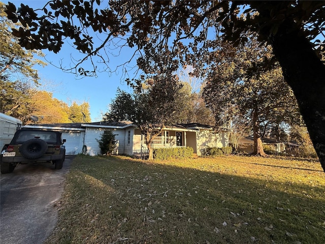 ranch-style home with a front lawn