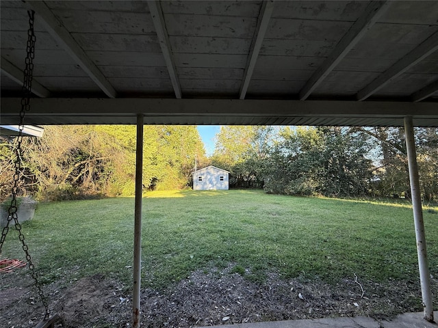 view of yard with an outbuilding and a storage unit