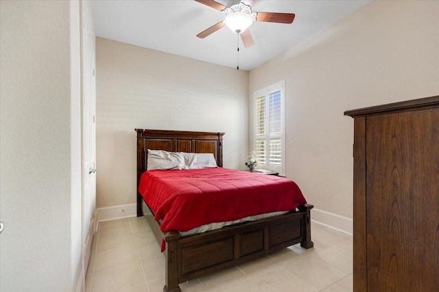 bedroom featuring light tile patterned floors, ceiling fan, and baseboards