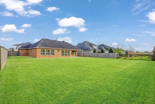 view of yard featuring a fenced backyard