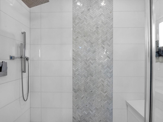 full bathroom with tiled shower