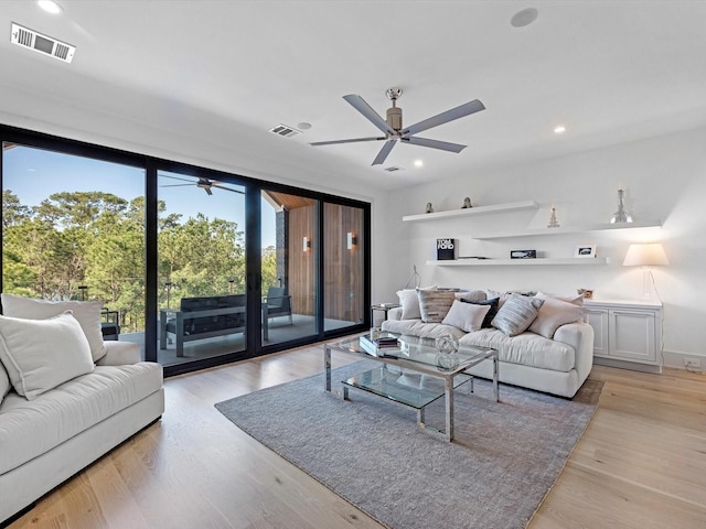 living area featuring visible vents, recessed lighting, light wood-style floors, and ceiling fan