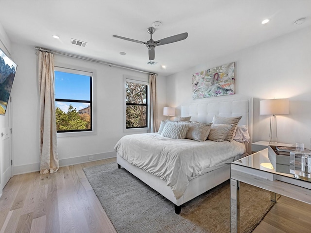 bedroom with recessed lighting, visible vents, baseboards, and light wood-style floors