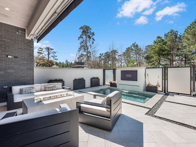 view of patio / terrace with an outdoor living space with a fire pit and fence