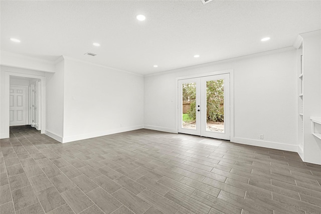 unfurnished room featuring wood finished floors, baseboards, visible vents, recessed lighting, and crown molding