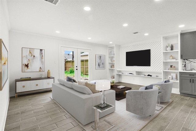 living room featuring visible vents, crown molding, wood tiled floor, recessed lighting, and french doors