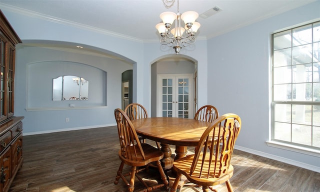 dining area with visible vents, a chandelier, dark wood-style floors, french doors, and arched walkways