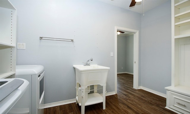 laundry area with a ceiling fan, washer and dryer, laundry area, baseboards, and dark wood-style flooring