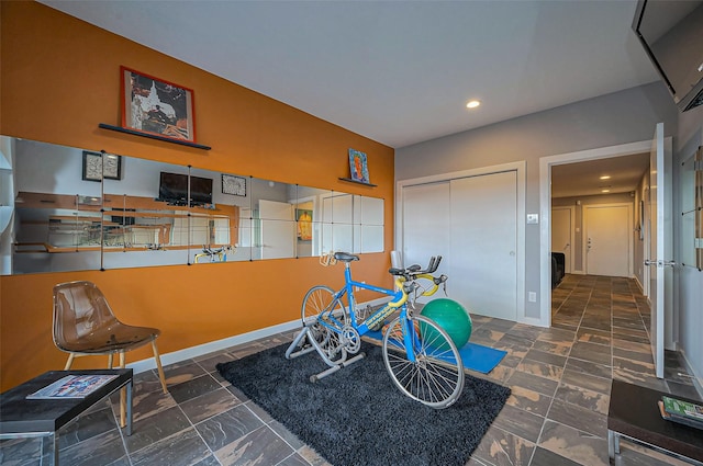 recreation room with recessed lighting and baseboards