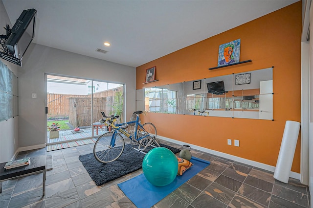 exercise room featuring baseboards, visible vents, and recessed lighting