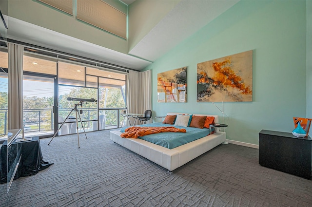 bedroom with carpet flooring, baseboards, and high vaulted ceiling