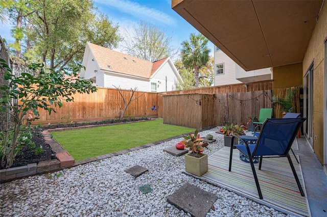 view of yard with a fenced backyard and a patio area