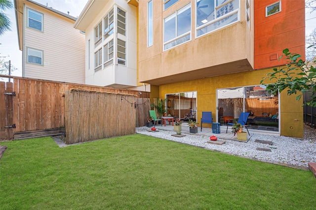 view of yard featuring a patio and a fenced backyard