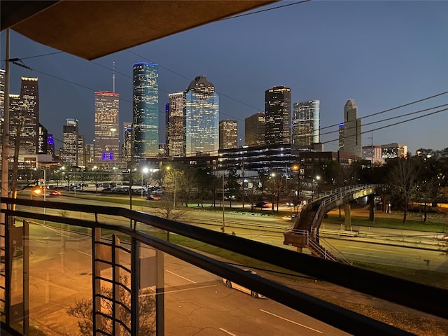 exterior space featuring a view of city lights