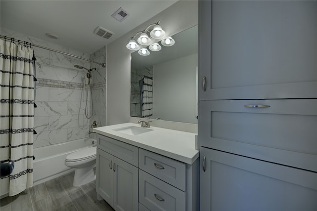 bathroom with visible vents, vanity, toilet, and shower / tub combo