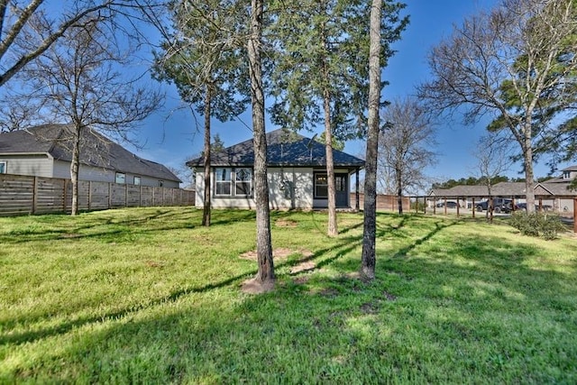 view of yard with a fenced backyard