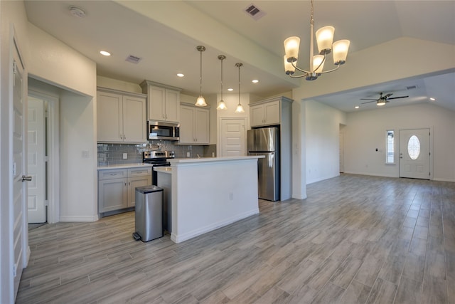 kitchen featuring open floor plan, visible vents, appliances with stainless steel finishes, and gray cabinetry
