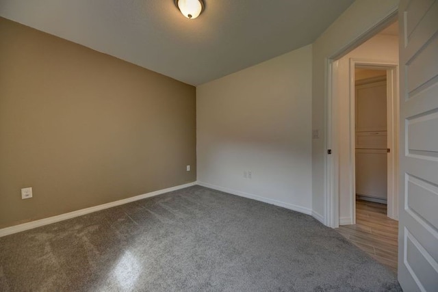 spare room featuring baseboards