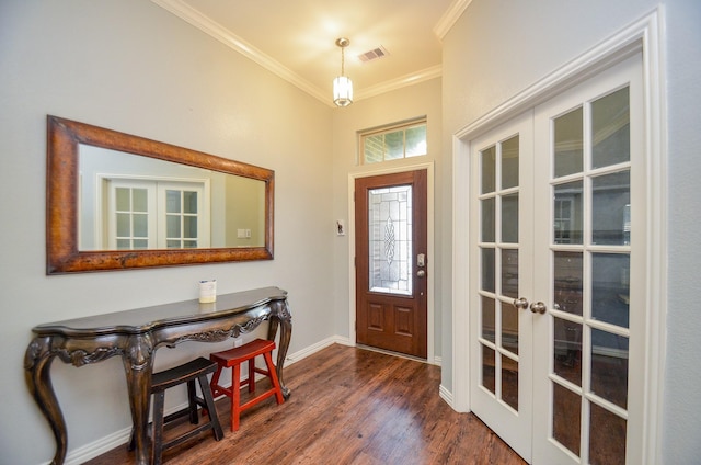 foyer featuring visible vents, dark wood-type flooring, baseboards, ornamental molding, and french doors