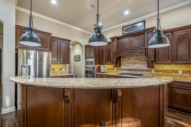 kitchen with ornamental molding, a center island, dark wood-style floors, and stainless steel appliances