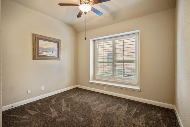 unfurnished room featuring a ceiling fan, vaulted ceiling, baseboards, and dark colored carpet