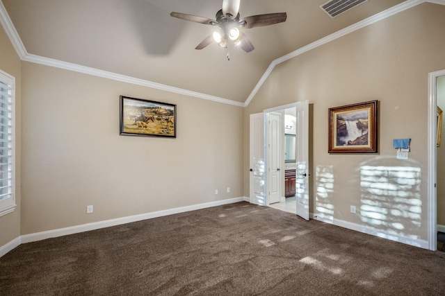 carpeted empty room featuring visible vents, lofted ceiling, baseboards, and ornamental molding