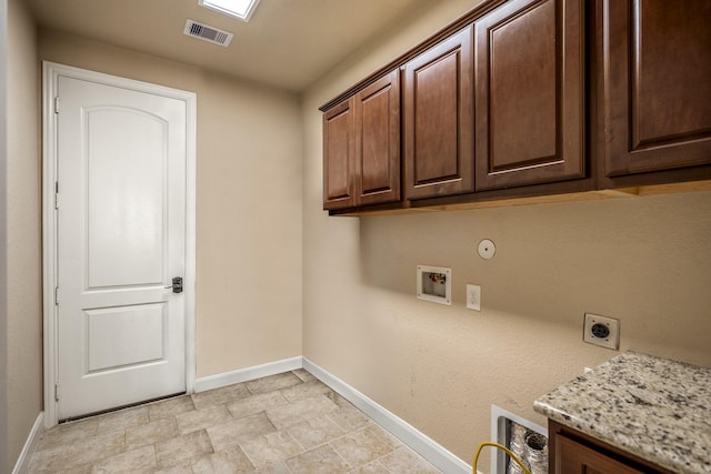 clothes washing area featuring baseboards, visible vents, cabinet space, electric dryer hookup, and washer hookup