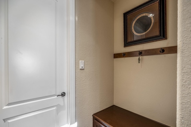 mudroom featuring a textured wall