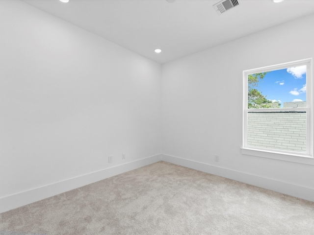 carpeted spare room with visible vents, recessed lighting, and baseboards