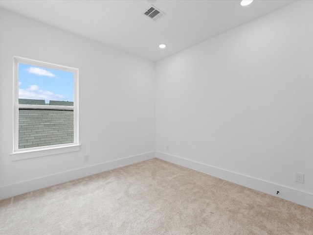 empty room with recessed lighting, visible vents, carpet floors, and baseboards