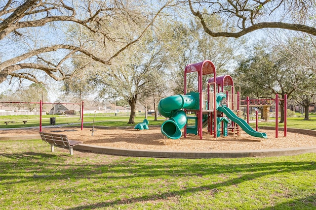 community jungle gym featuring a yard