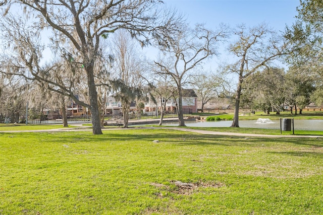 view of property's community featuring a yard