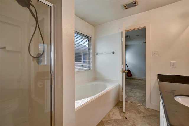 full bath featuring visible vents, vanity, a garden tub, and a shower stall