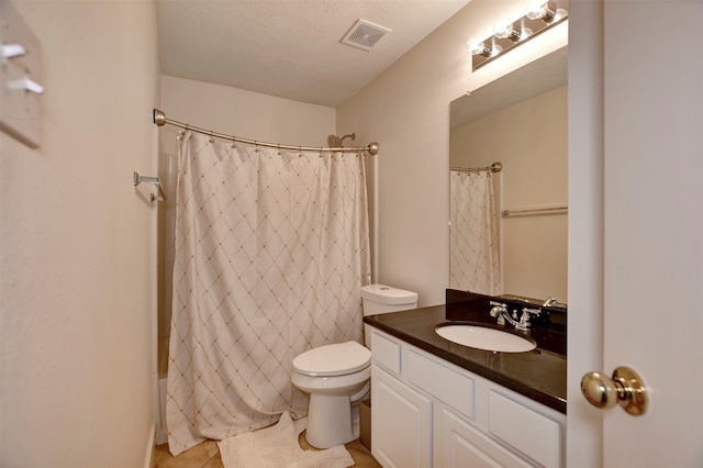 full bath featuring visible vents, toilet, vanity, shower / bath combination with curtain, and a textured ceiling