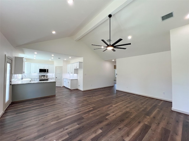 unfurnished living room with visible vents, beam ceiling, high vaulted ceiling, a ceiling fan, and dark wood-style floors