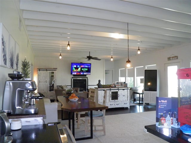 dining area with beam ceiling, wine cooler, and ceiling fan