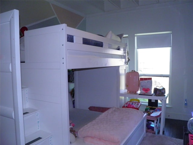 bedroom with wood finished floors