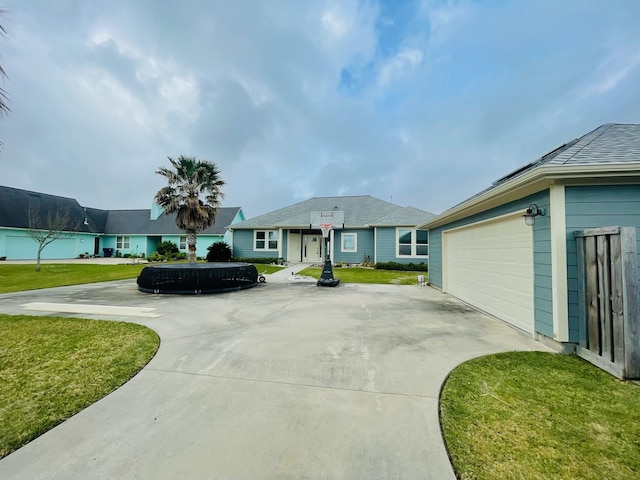 view of front of home with a front yard and driveway