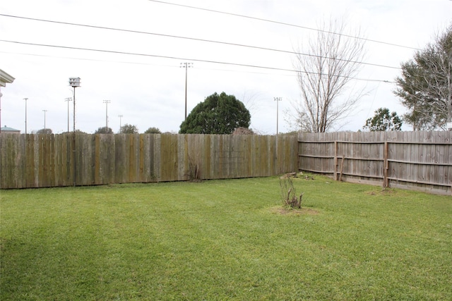 view of yard featuring a fenced backyard