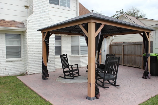 view of patio / terrace with a gazebo and fence