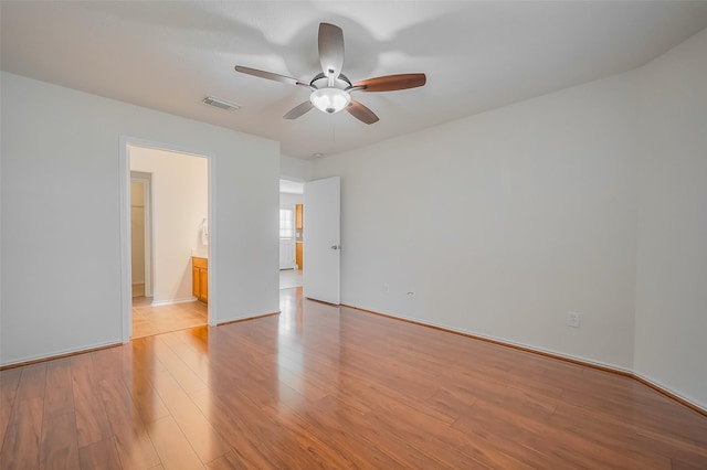 unfurnished bedroom featuring visible vents, baseboards, a ceiling fan, and light wood finished floors