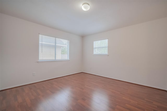 empty room with wood finished floors