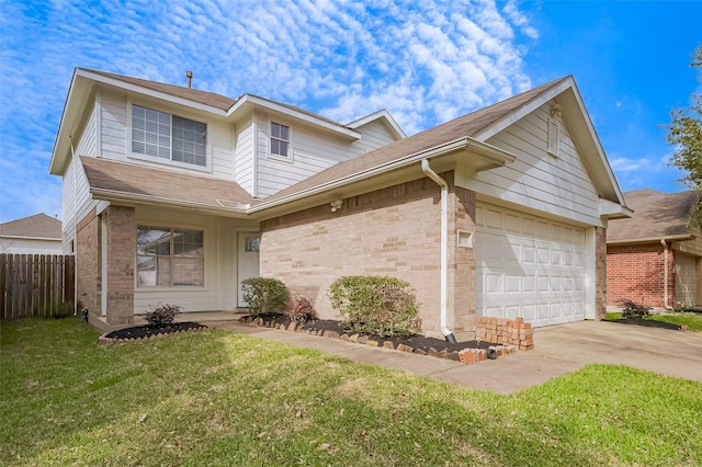 traditional-style house with brick siding, fence, concrete driveway, a front yard, and an attached garage