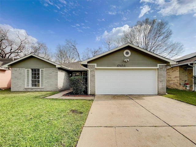 view of front of house featuring brick siding, an attached garage, concrete driveway, and a front lawn