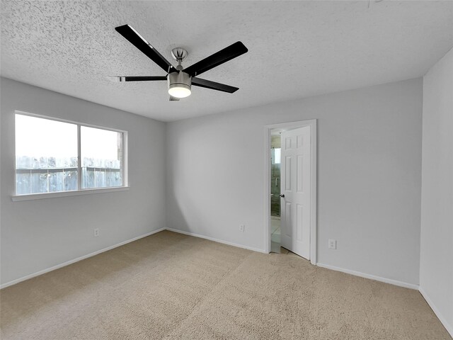 17103 Costero Dr, Houston, TX 77083 - carpeted empty room with baseboards, a ceiling fan, and a textured ceiling