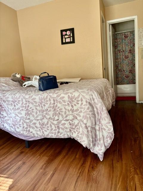 bedroom featuring wood finished floors